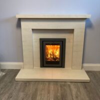 Barbas Unilux 740 wood burner with limestone Frensham fireplace