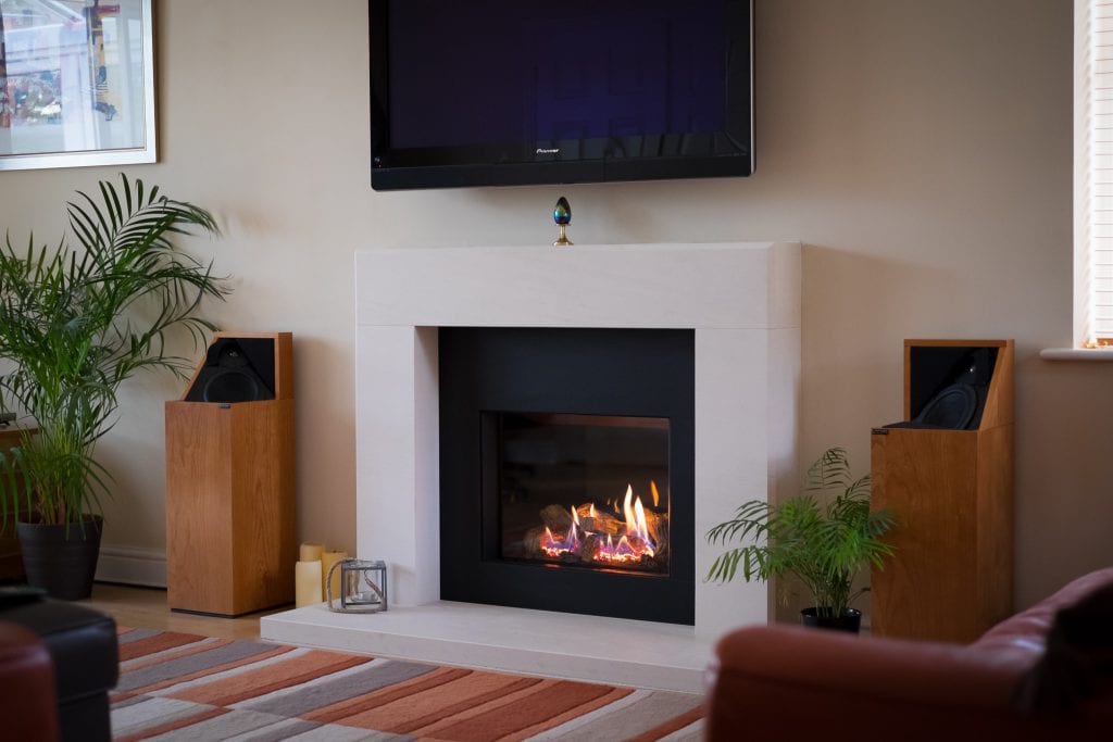 Bespoke limestone fireplace withGazco Riva 2500 gasfire-